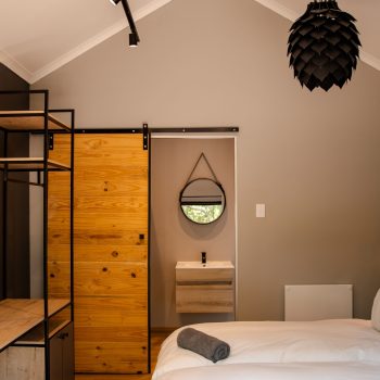 Interior of Simbali’s Bush Bungalow with natural wood finishes and stylish decor