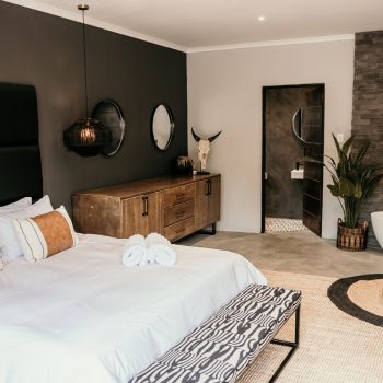 Modern and masculine Groom Suite at Simbali with lounge area and prep space